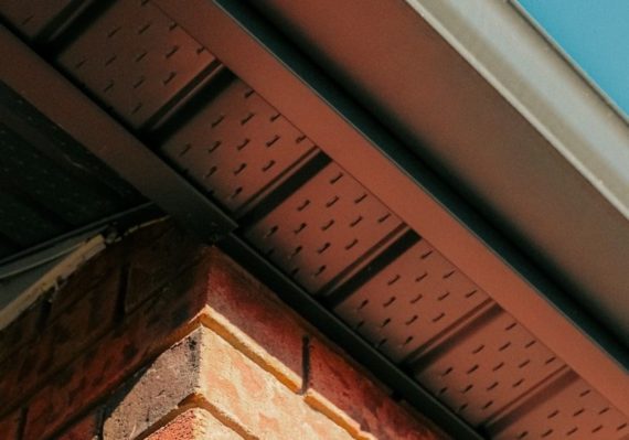 a close up of a brick building with a blue sky in the background
